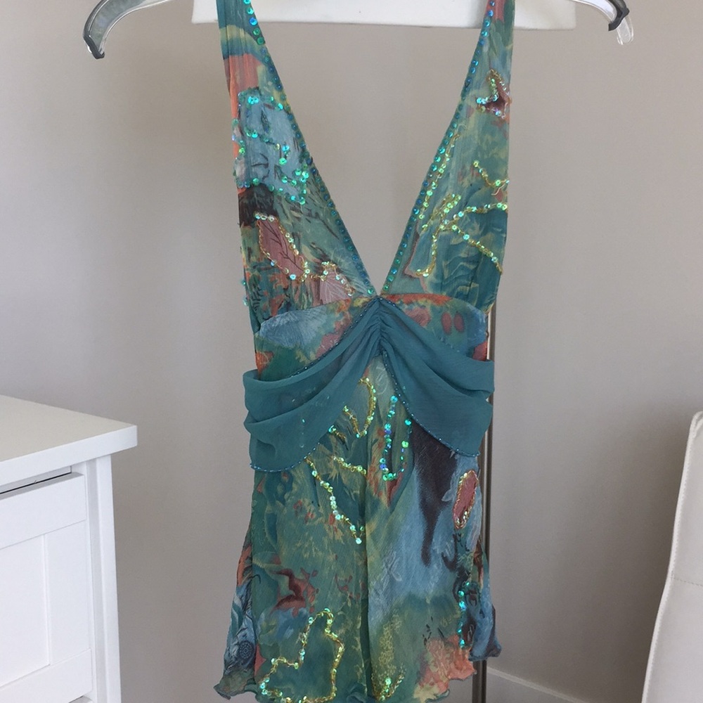 Sequins halter top with a low back.